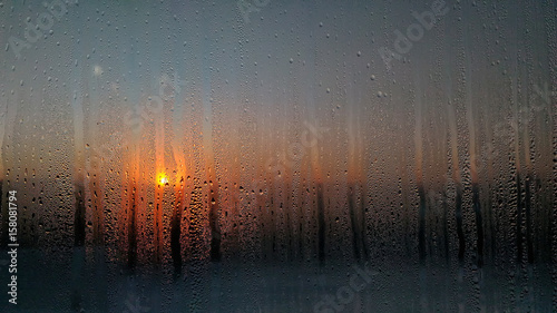 condensate water drops on glass shines through Sun