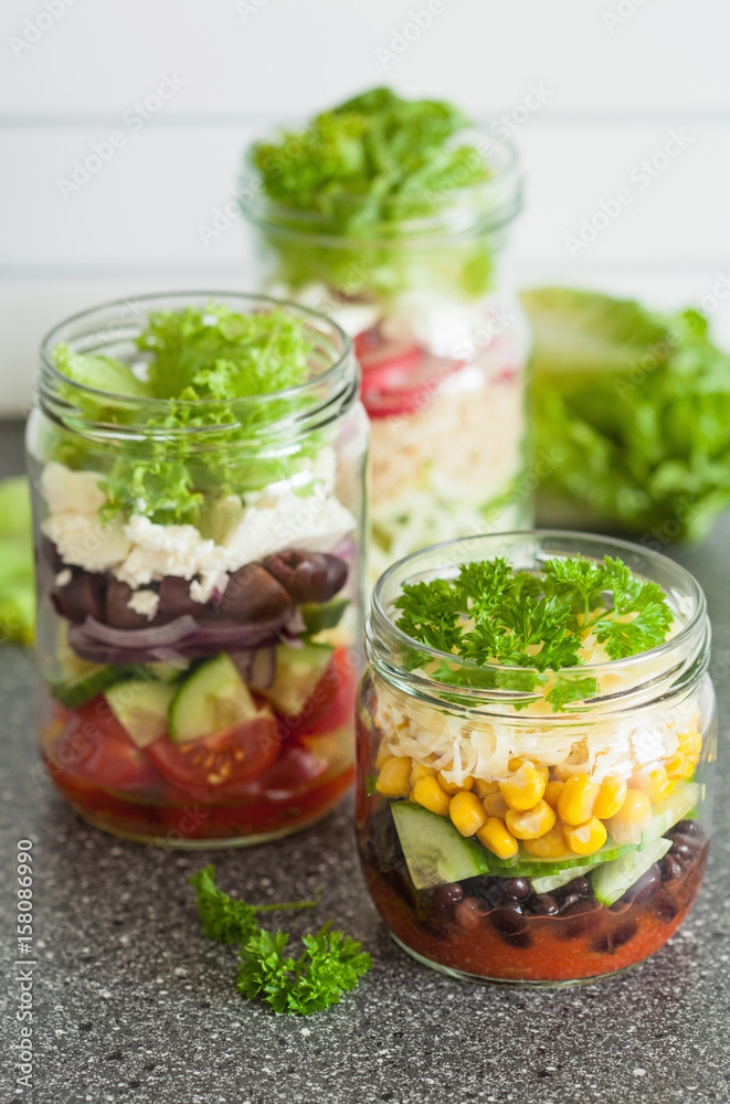 healthy vegetable cheese salad in mason jars
