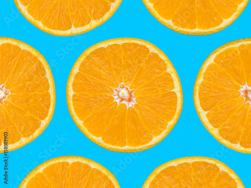 Orange slices pattern on blue background, pop art style