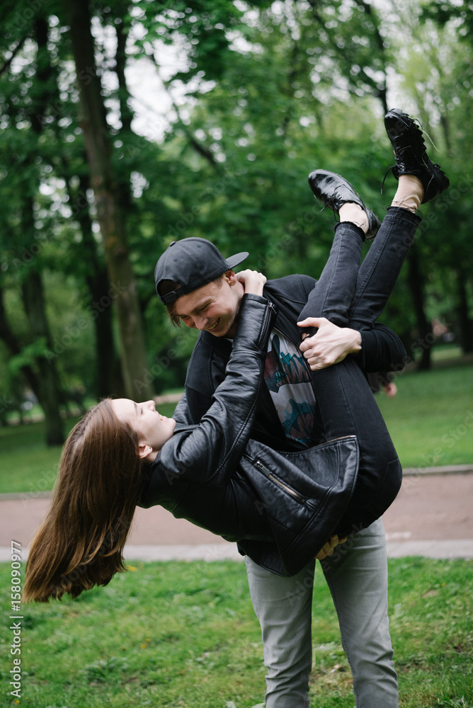 loving couple fulling around in the park loving couple fulling around in the park