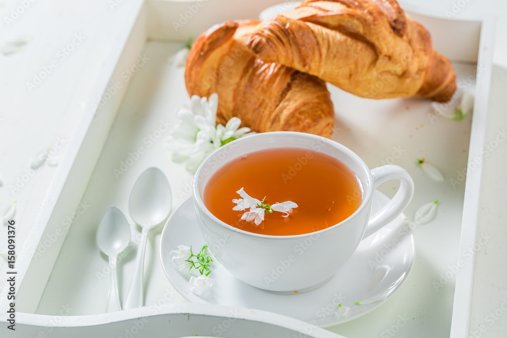 Healthy tea with honey in sunny summer day Healthy tea with honey in sunny summer day