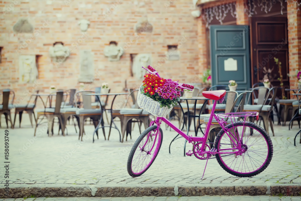 pink bike standing on place