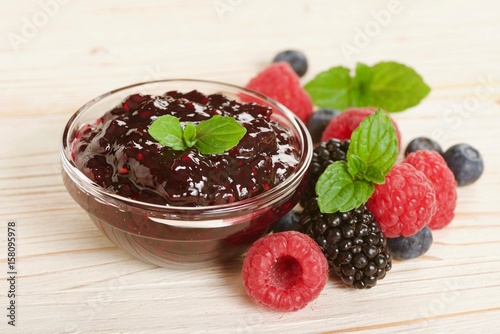 forest fruit jam on a wooden background