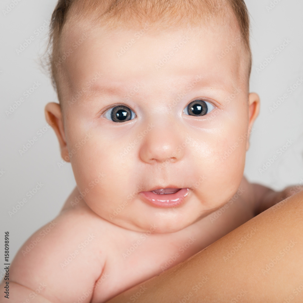 Infant. Portrait of a beautiful little child. Baby closeup Infant. Portrait of a beautiful little child. Baby closeup