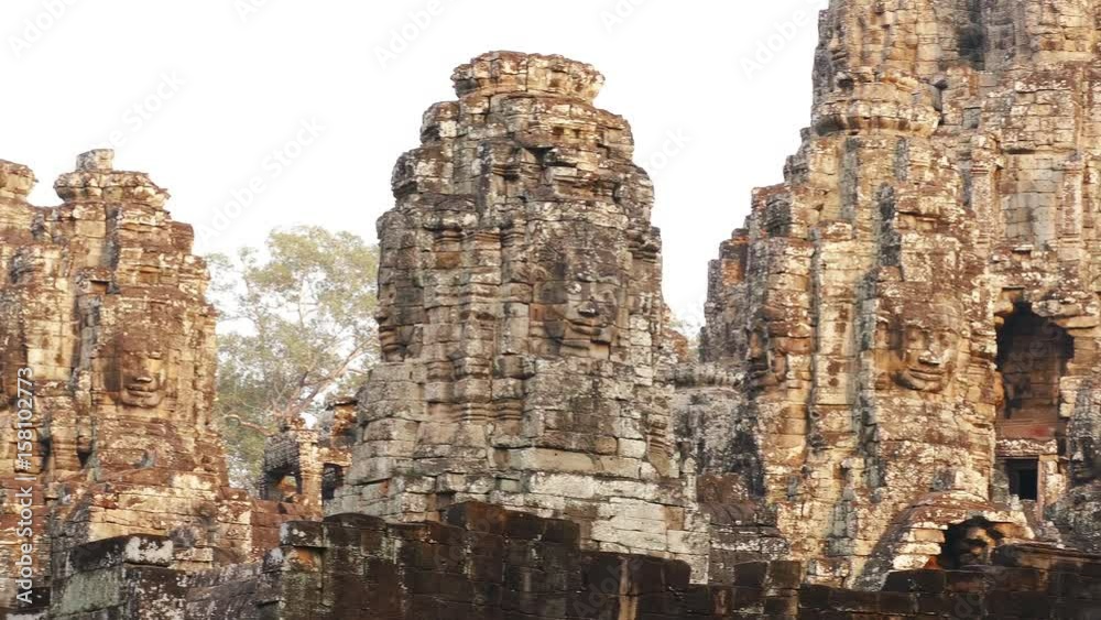 Ancient Bayon temple in Angkor Wat at sunset. Siem Reap, Cambodia. Ancient Bayon temple in Angkor Wat at sunset. Siem Reap, Cambodia.