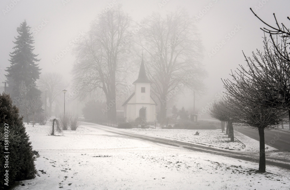 Chapel in winter mist