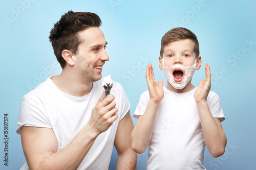 Father and son shaving on l...