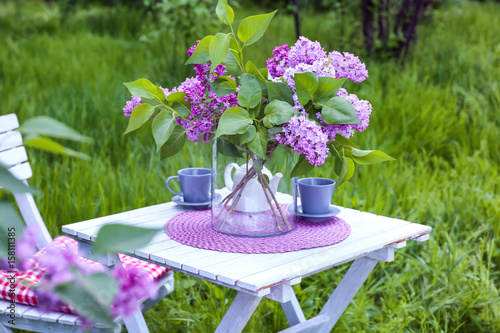 Lilac flowers on table in garden