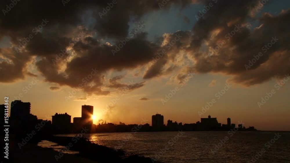 Impressive sunset on the Malecon with dramatic sky in Old Havana, Cuba Impressive sunset on the Malecon with dramatic sky in Old Havana, Cuba