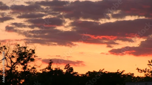 Slide sunset clouds dusk slowmotion red colors. photo