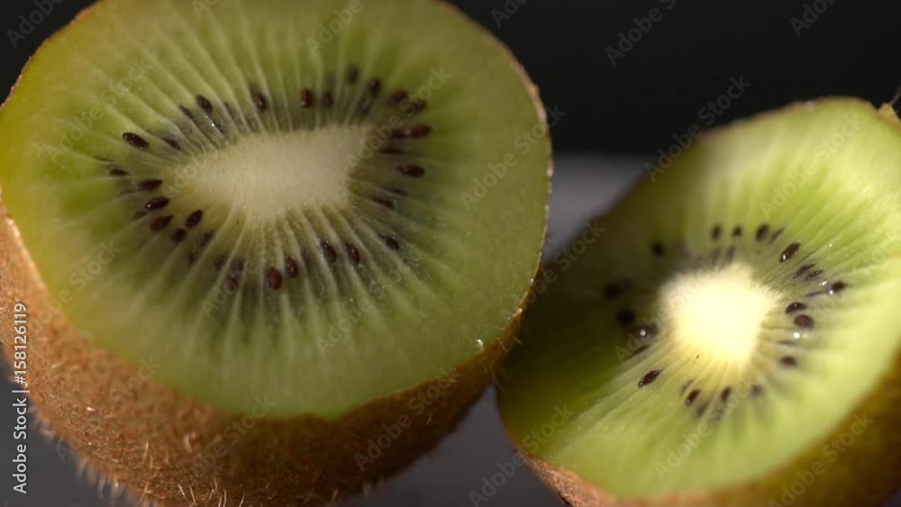 Closeup of the sliced kiwi on the black background Closeup of the sliced kiwi on the black background