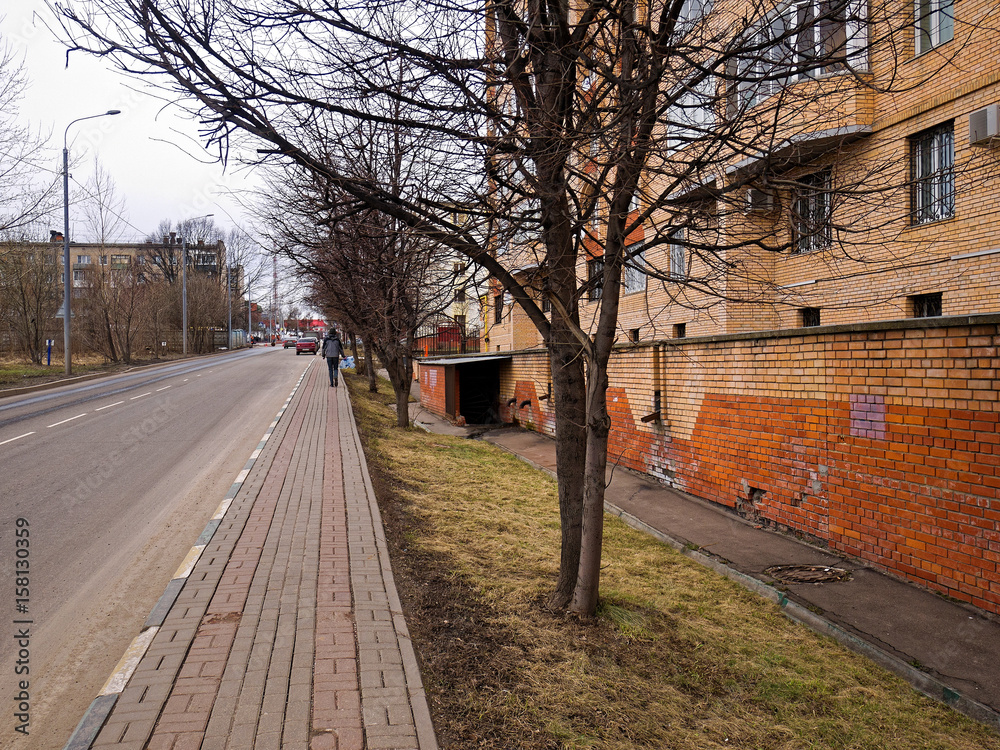 The yellow brick house in the new Moscow in the spring, the village of Kommunarka