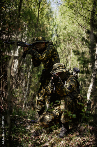 Military men with submachine gun © snedorez