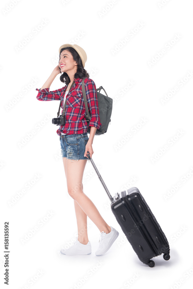 Travel concept. Full length portrait of asian pretty young woman in hat with backpack and valise Travel concept. Full length portrait of asian pretty young woman in hat with backpack and valise