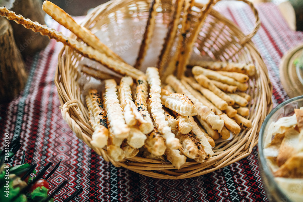 Sticks of bread served in a basket