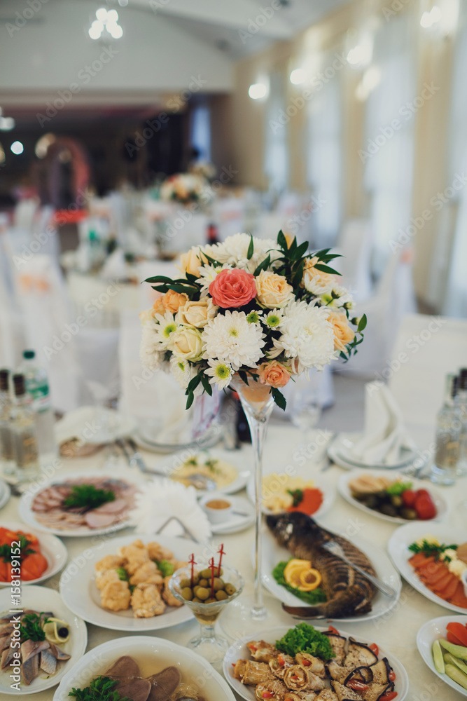 Fototapeta premium Colorful bouquet as a centerpiece of dinner table
