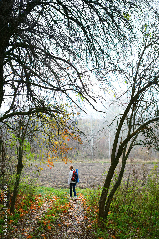 Woman hiker relax on the autumn nature