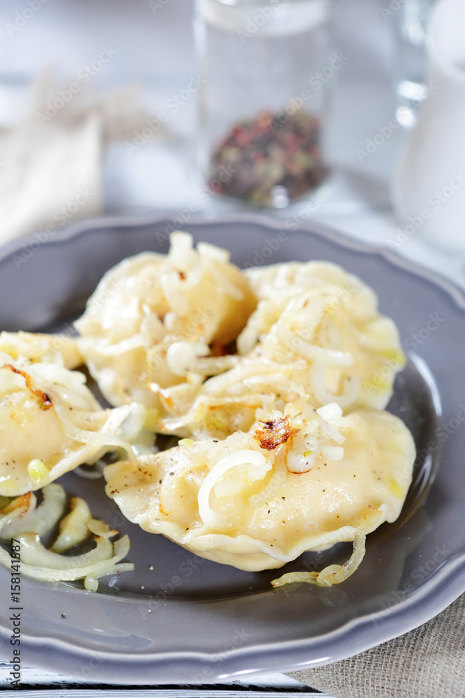 Dumplings with onions on a plate Dumplings with onions on a plate
