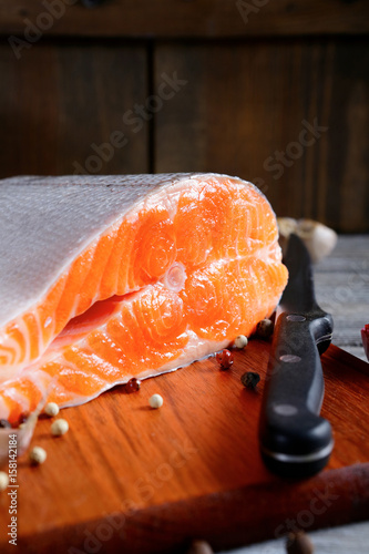 Delicious portion of fresh salmon steak slices with spices
