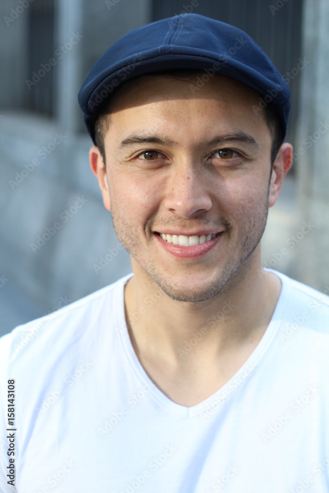 Ethnically ambiguous male smiling close up 