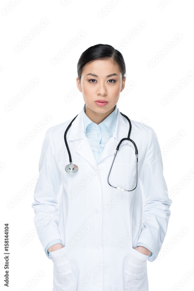 portrait of confident doctor with hands in pockets looking at camera isolated on white portrait of confident doctor with hands in pockets looking at camera isolated on white