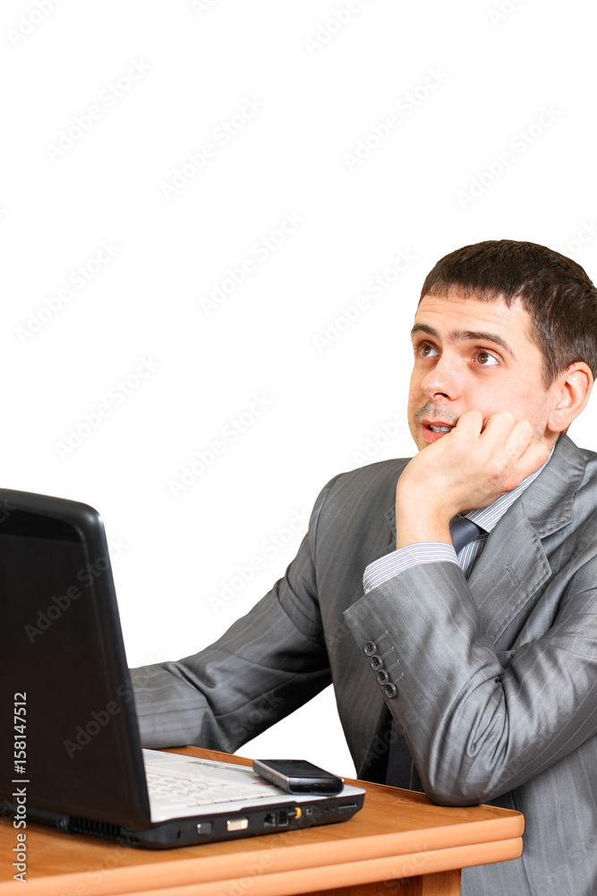 The young businessman in front of laptop The young businessman in front of laptop