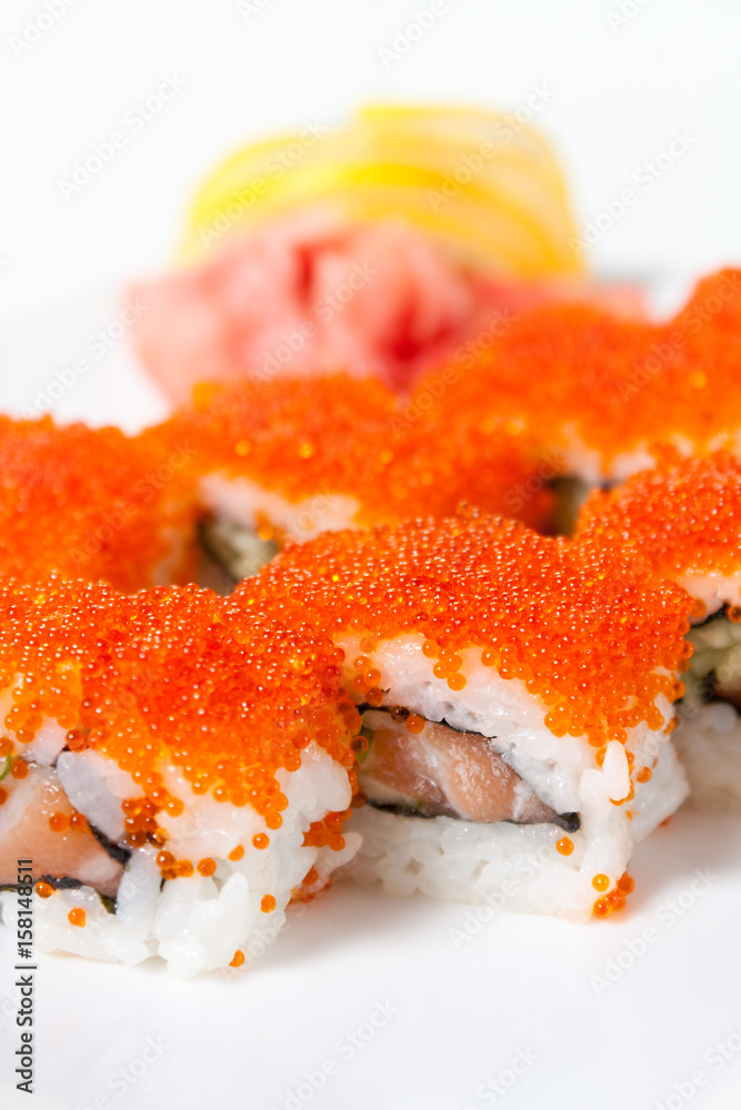 Sushi Roll with tobiko caviar, salmon, avocado and cucumber Sushi Roll with tobiko caviar, salmon, avocado and cucumber