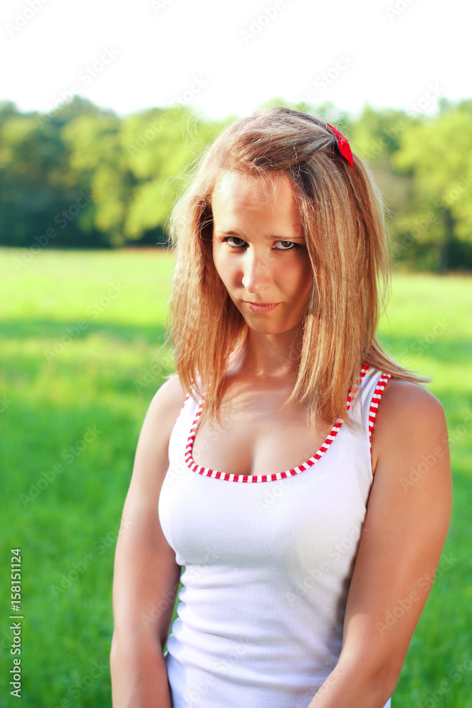 Portrait of young woman in the sullenly glance Portrait of young woman in the sullenly glance