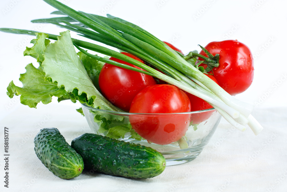 Fresh tomatoes, cucumber, lettuce, green onions in a salad-bowl Fresh tomatoes, cucumber, lettuce, green onions in a salad-bowl
