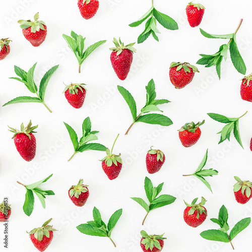 Colourful pattern of strawberries and mint leaves on white background. Background of berries. Flat lay, top view.