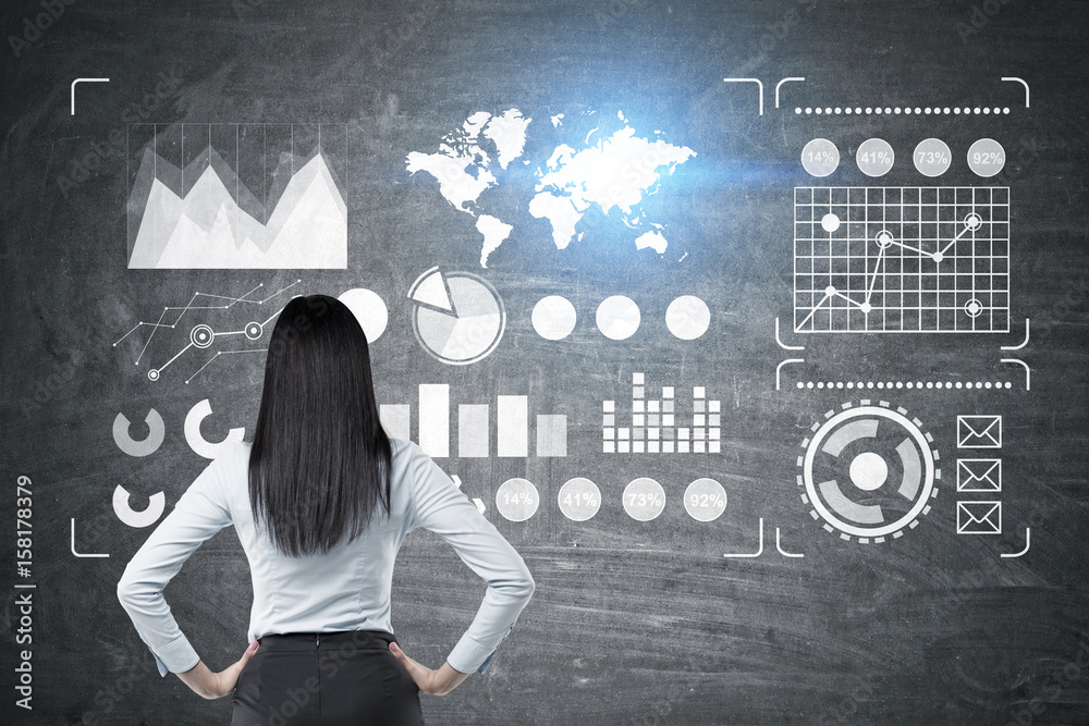Woman looking at chalkboard, graphs Woman looking at chalkboard, graphs