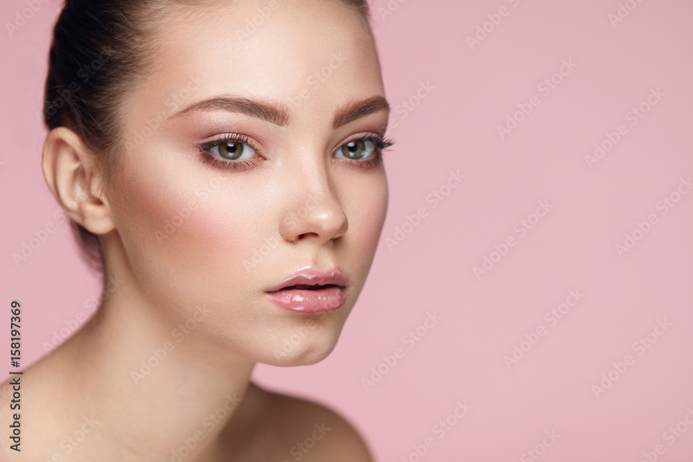 Facial Beauty Makeup. Woman With Fresh Face On Pink Background Facial Beauty Makeup. Woman With Fresh Face On Pink Background