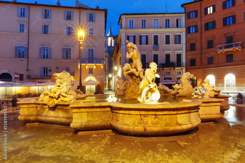 The Fountain of Neptune on the famous Piazza Navona Square at night, Rome, Italy.