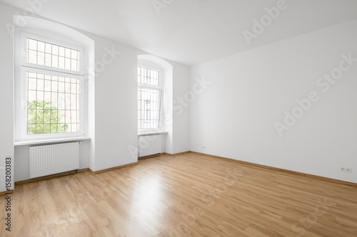 empty room, wooden floor in new apartment