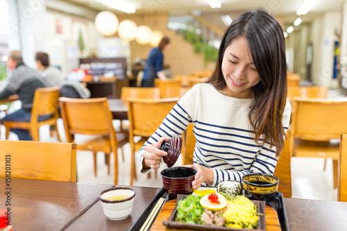 Woman enjoy her meal in restaurant