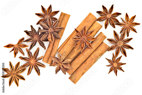Star anise and cinnamon sticks herb isolates on white back ground