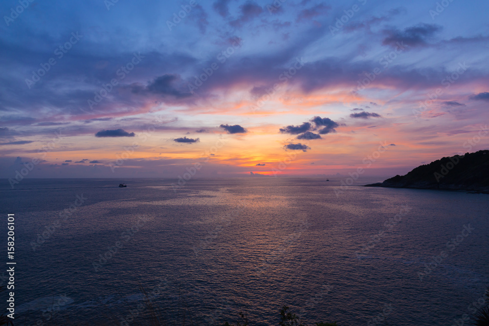 Colorful dramatic sky with cloud at sunset or twilight time.Sky with sun background at Promthep Cape Phuket Thailand