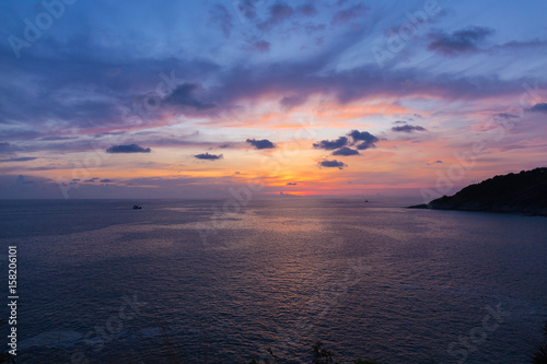 Fototapeta Naklejka Na Ścianę i Meble -  Colorful dramatic sky with cloud at sunset or twilight time.Sky with sun background at Promthep Cape Phuket Thailand