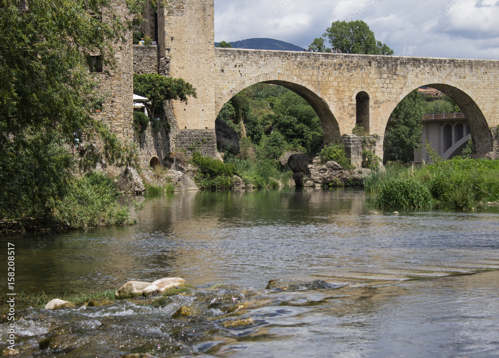 Bridge in the city-the castle of Besalú (bottom view, with the creek)