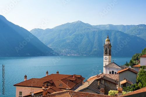 Fotografie, Obraz romantic view on lake como and old church tower in north Italy