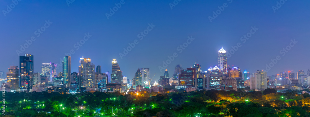 Bangkok city skyline over Lumpini park.