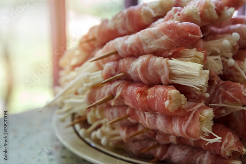Japanese cuisine, bacon and Enoki Mushroom roll