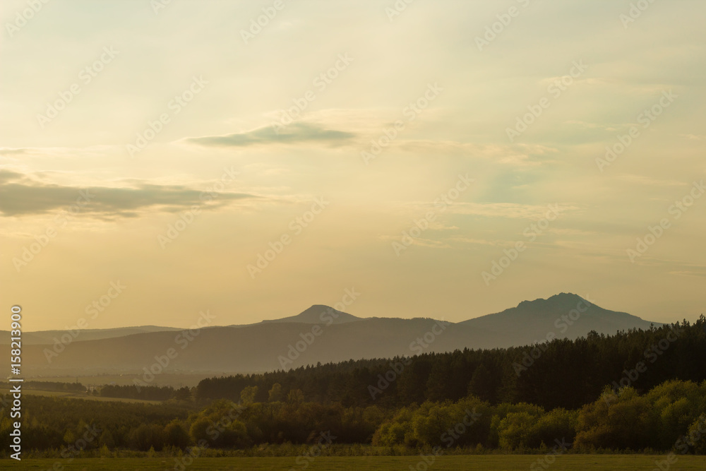 beautiful landscape with the Ural mountains at sunset beautiful landscape with the Ural mountains at sunset