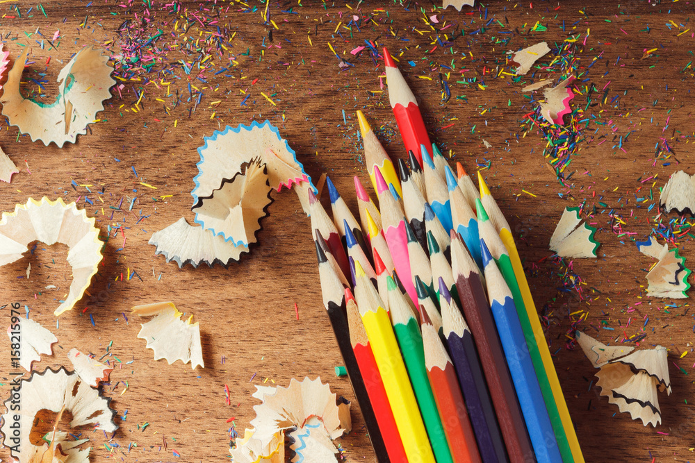 Heap of colored pencils, wooden background Heap of colored pencils, wooden background