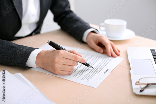 Business woman ready to sign a contract photo