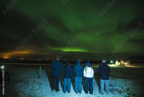 A Group of People Watch the Northern Lights in Iceland