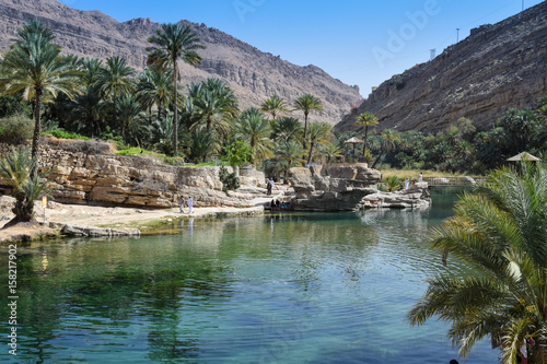 Clear water in wadi in Oman mountains photo