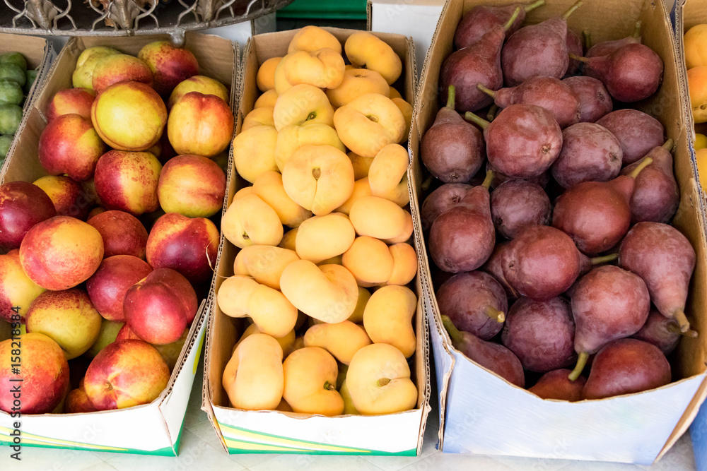 Boxes of nectarines and figs at market Boxes of nectarines and figs at market