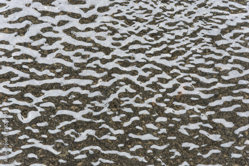 Waves on the pavement from the heavy rain.