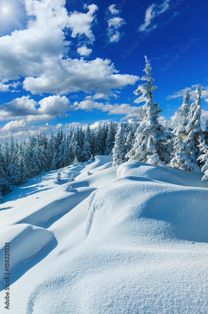 Snowdrifts on winter snow covered mountainside
